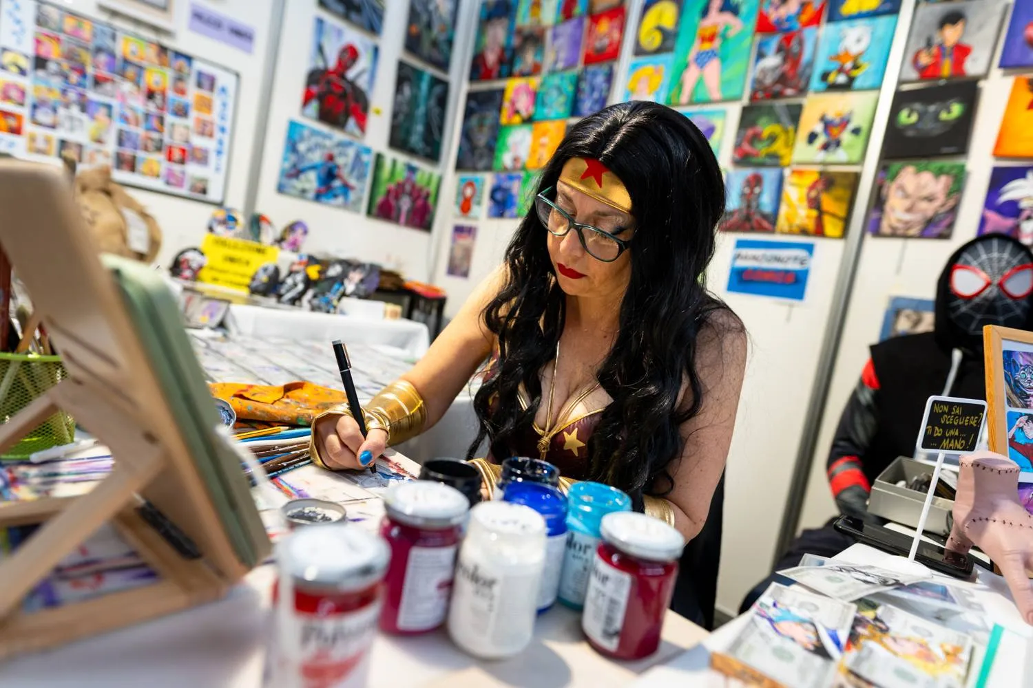 Artist at work at her table